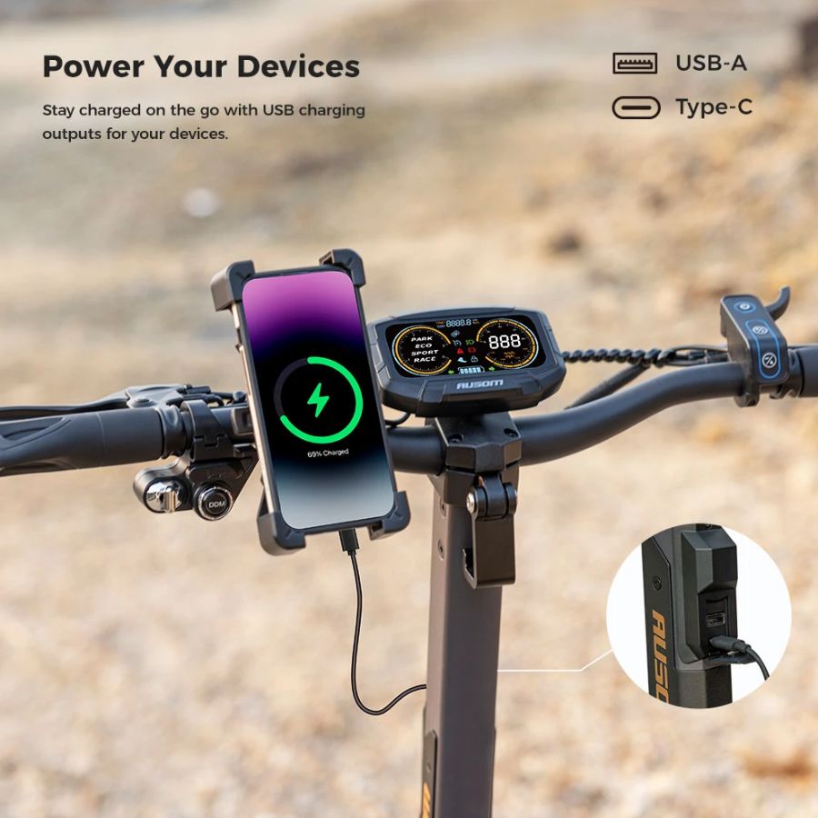 L2 Max Scooter handlebar with phone holder and USB charging ports on a blurred natural background