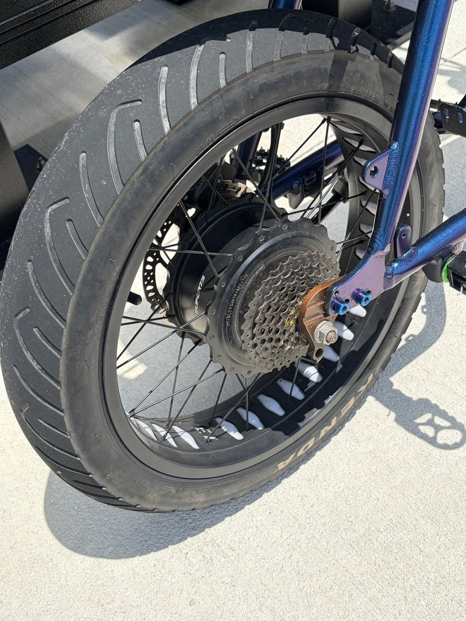Kenda Kraze 20x4.25 e-bike tire mounted on a rear hub motor wheel, drive side view