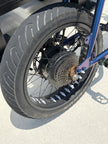 Kenda Kraze 20x4.25 e-bike tire mounted on a rear hub motor wheel, drive side view
