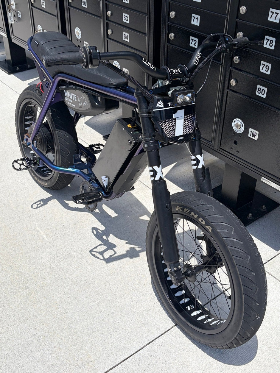 Super73 style e-bike fitted with Kenda Kraze 20x4.25 supermoto street tires, front three-quarter view