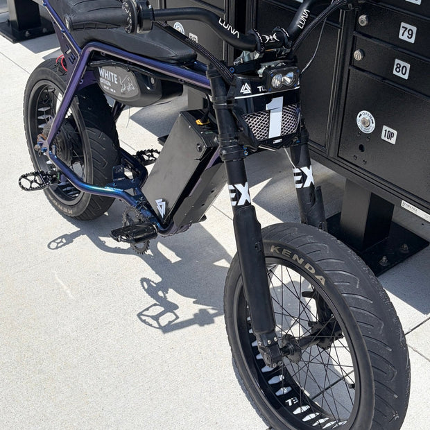Super73 style e-bike fitted with Kenda Kraze 20x4.25 supermoto street tires, front three-quarter view