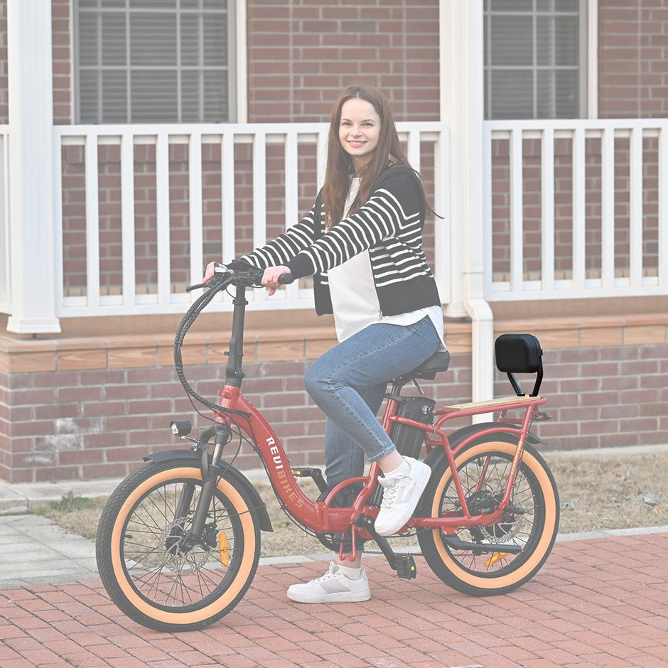 Rider on a red Revi Rebel 2 with the passenger backrest installed