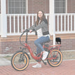 Rider on a red Revi Rebel 2 with the passenger backrest installed
