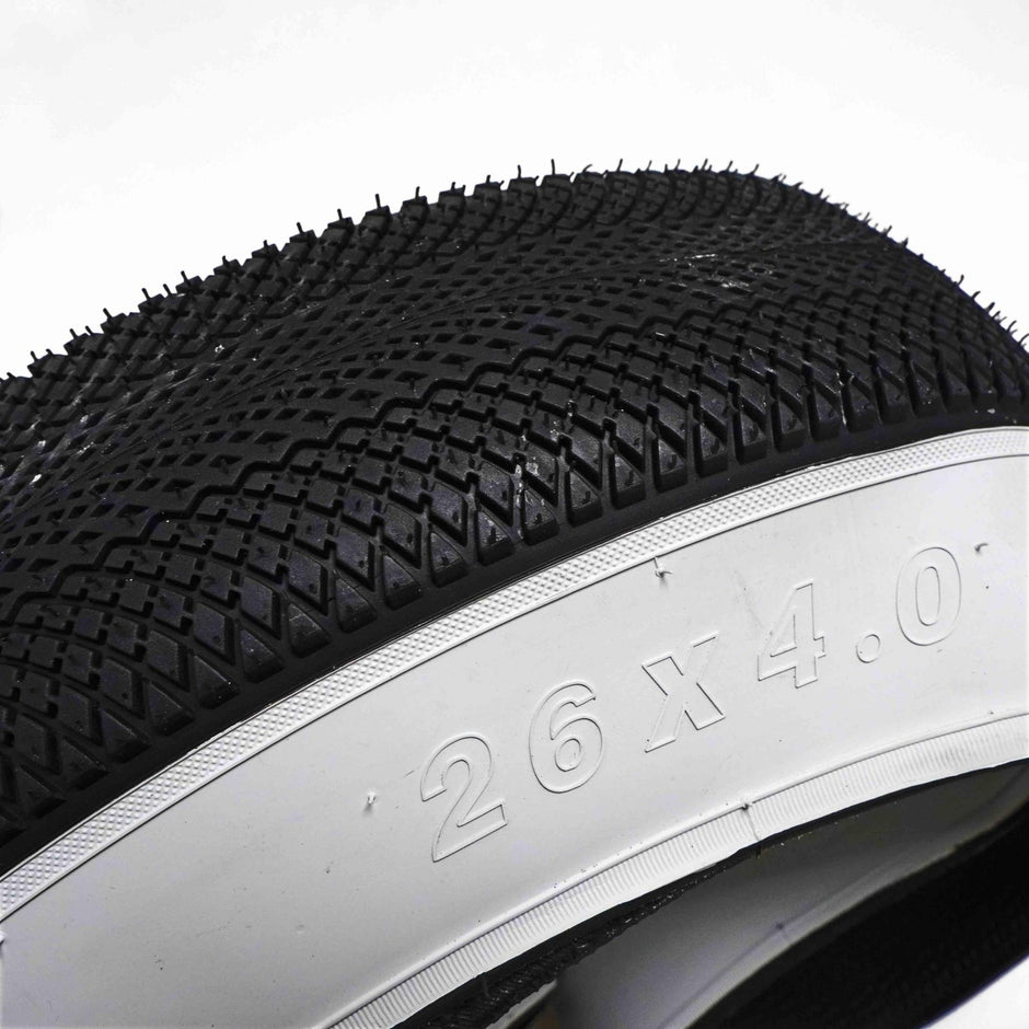 Vee Tire Co. E-Speedster 26 x 4.0 white wall fat tire sidewall close-up with size marking