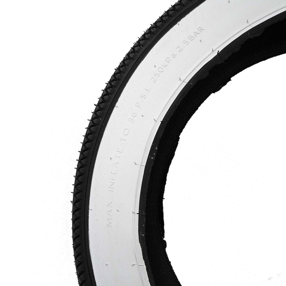 Close-up detail of the Vee Tire Co. E-Speedster white wall fat tire tread and whitewall edge