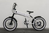 White e-bike fitted with Vee Tire Co. E-Speedster white wall fat tires, full side view showing the Speedster sidewall lettering